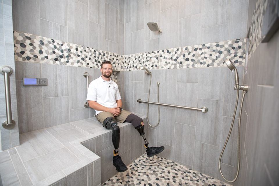Caleb in the shower installed by NTCA member Mourelatos Tile Pro of Tucson.