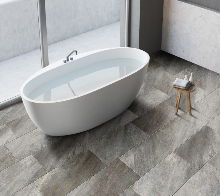 bath scene with tile floor that looks like quartzite